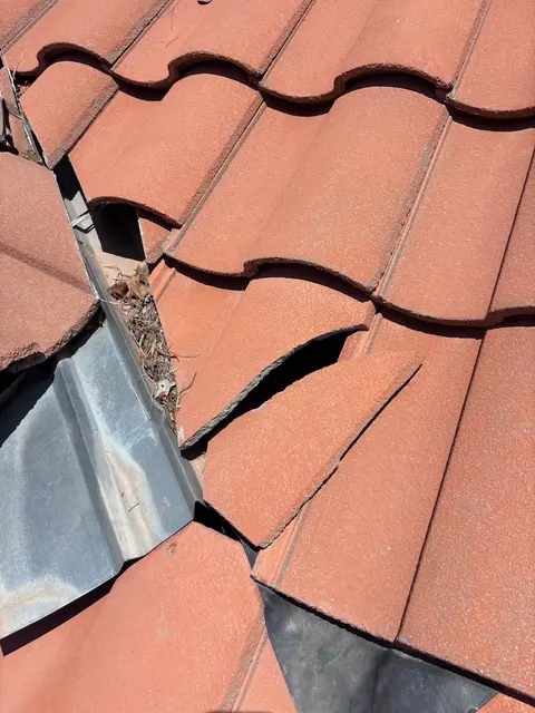 Close-up of a cracked roof tile on a Phoenix home