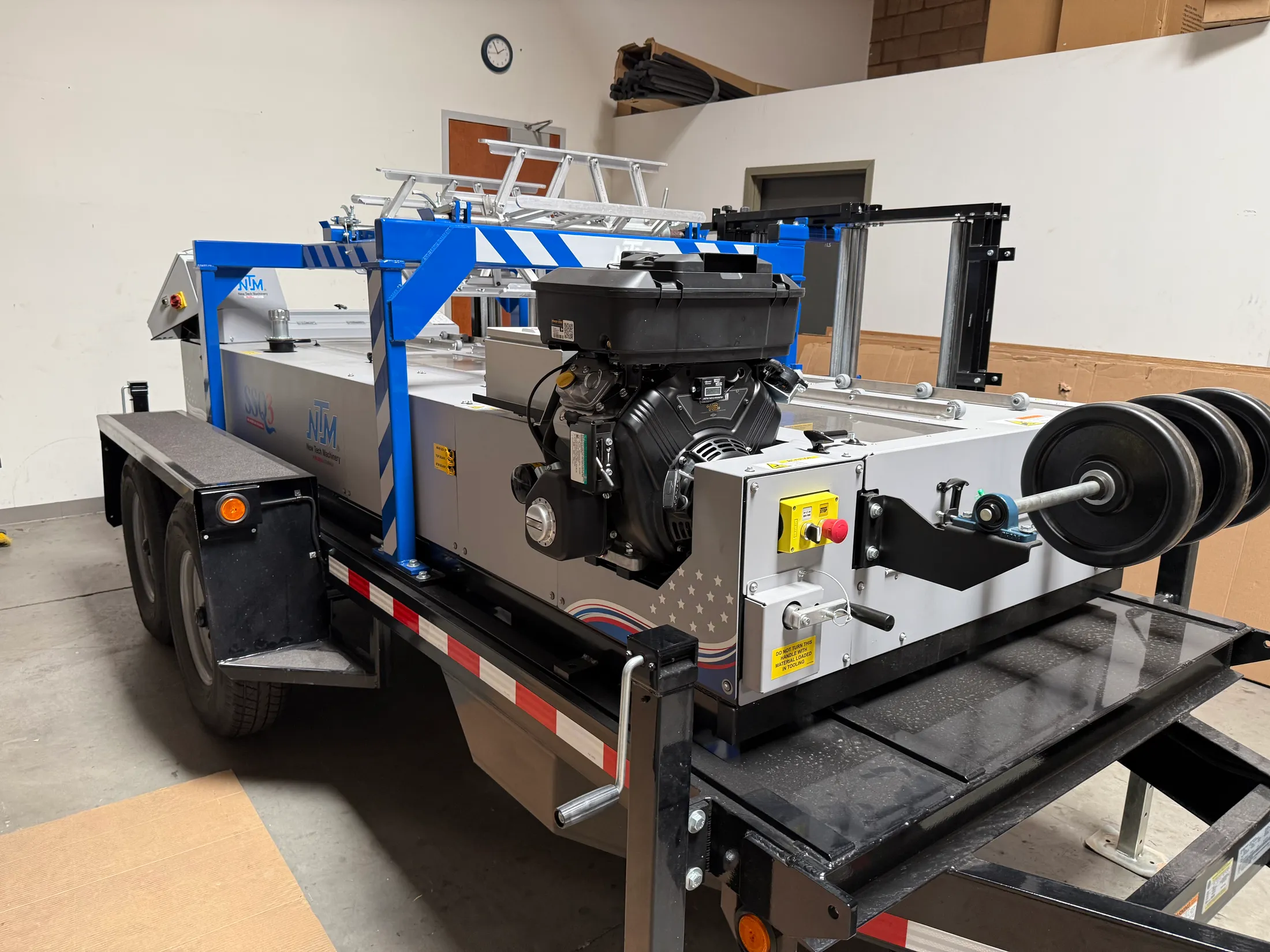 Pinnacle Roofing's trailer-mounted standing seam roll former