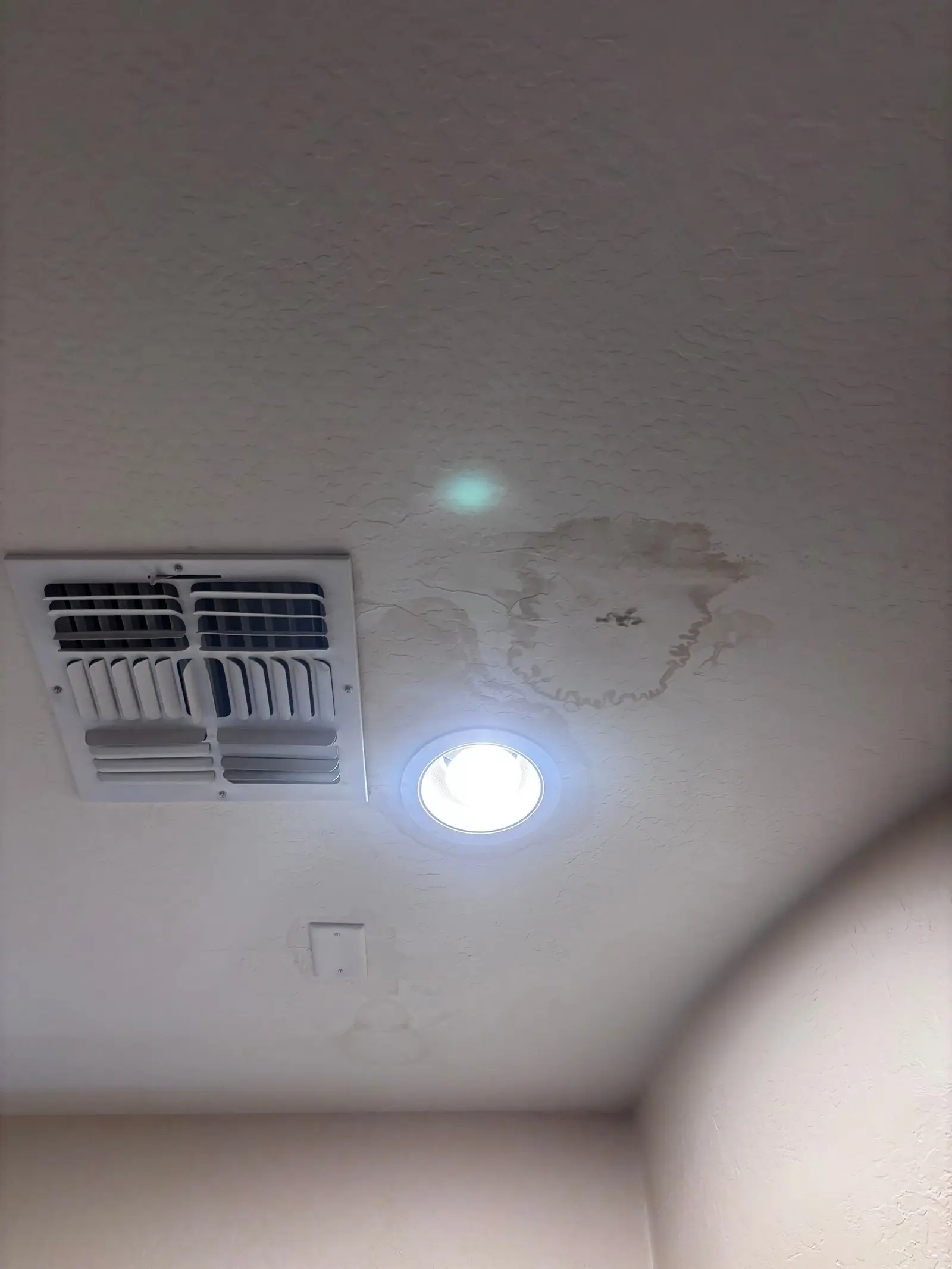 Drywall water damage caused by a roof leak