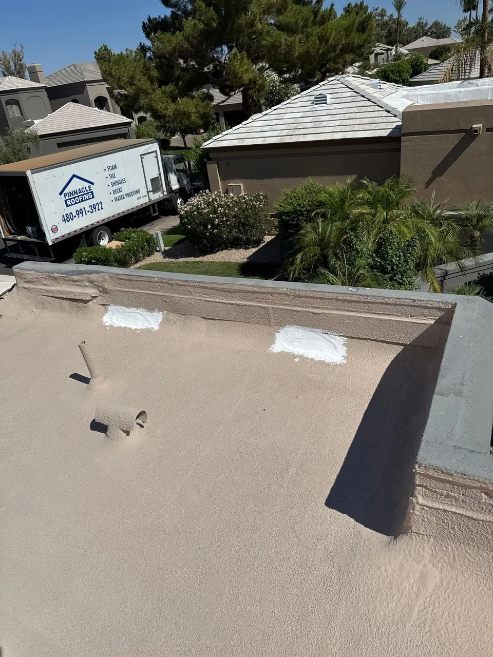 Pinnacle Roofing crew performing a roof repair on a Scottsdale home