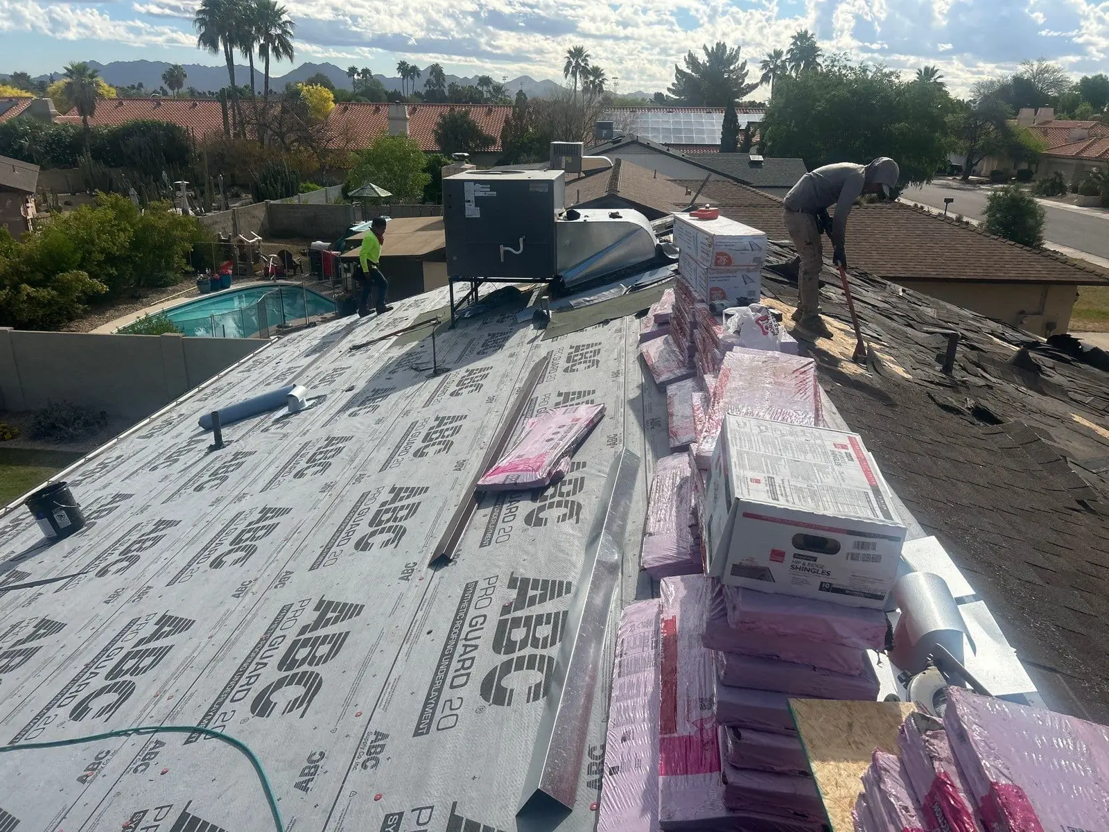 Shingle roof replacement in progress
