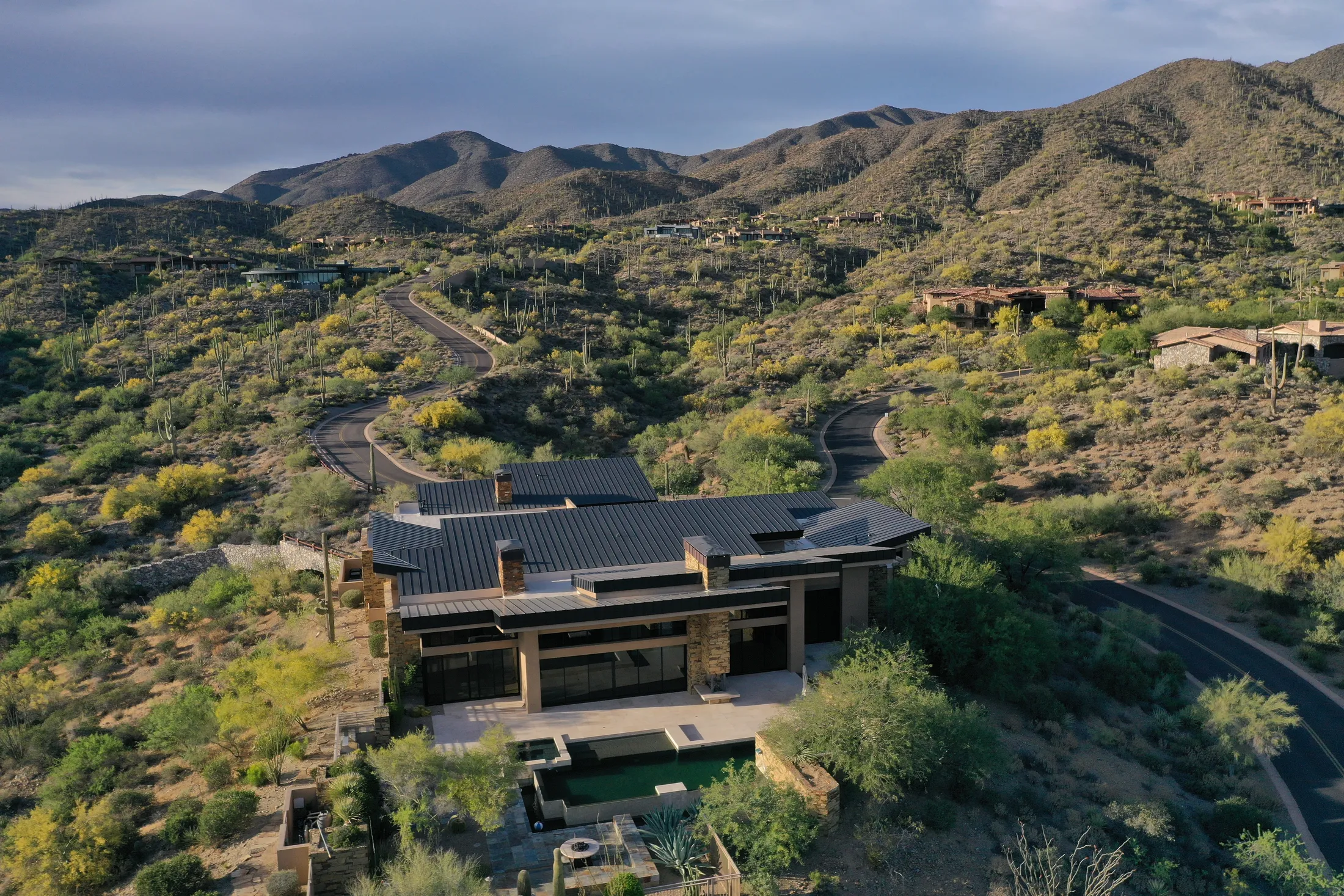 Finished dark standing seam metal roof on a custom home in the Phoenix desert foothills