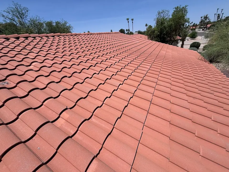 Tile roof with worn and displaced tiles in need of repair