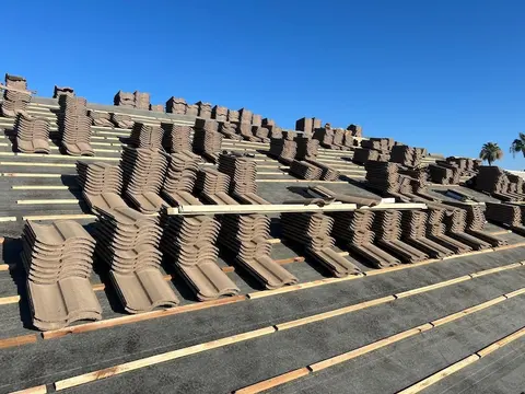 Tile roof replacement in progress on a Phoenix home